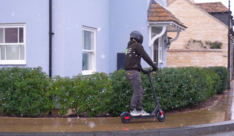 Josh Testing an Electric Scooter's Handling in the Rain